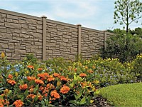 <b>Brown Granite Ecostone Simtek Fence bordered by a flower bed</b>